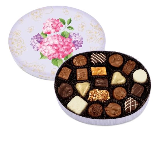 Hello Spring Sees Box - Welcome brighter days with this delightful assortment of premium milk, dark and white chocolates. Nestled inside a gorgeous pastel box with floral details, there’s no sweeter way to celebrate the season. Box measures 6.5” x 8.5” x 1.75”. Approximately 21 pieces  Raspberry Truffle, Light Chocolate Truffle, Milk Almond Caramel, Dark Almonds, Cashew Brittle, Milk Bordeaux™, Milk Almonds (2), Lemon Truffle, Dark Chocolate Chip Truffle, Divinity Puff, Milk Mocha, Dark Walnut Square, Milk Butterscotch Square, Milk Foil Heart (4), Toffee-ette®, Milk Chocolate Buttercream, Dark Butterchew