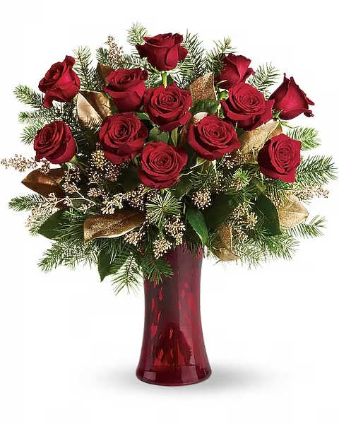 A Christmas Dozen - Dazzling and delightful. Red roses make a dashing holiday gift, especially when they are arranged with brilliant holiday touches and delivered in a ruby red vase. Standard 12 roses Deluxe 18 roses Premium 24 roses Twelve beautiful rose blossoms mix with salal, eucalyptus and golden fir branches in a radiantly red glass vase.  