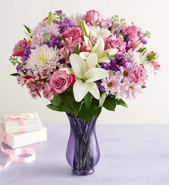 Love You Mom Bouquet - Surprise the woman you love more than anything. Our Mother’s Day bouquet is gathered fresh on our farms, showcasing a lovely mix of blooms in purple, pink and white. Whether you’re celebrating together or sending from miles away, it’s a special gift she’ll always remember.