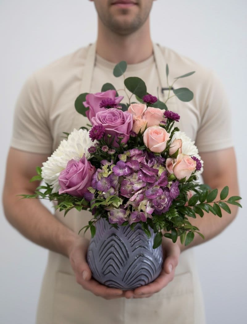 Lavender Lux - A  dreamy floral arrangement for your someone special, created with blooms in shades of lavenders, pinks and whites.  This beautiful display comes arranged in a lovely frosted lavender keepsake vase.  