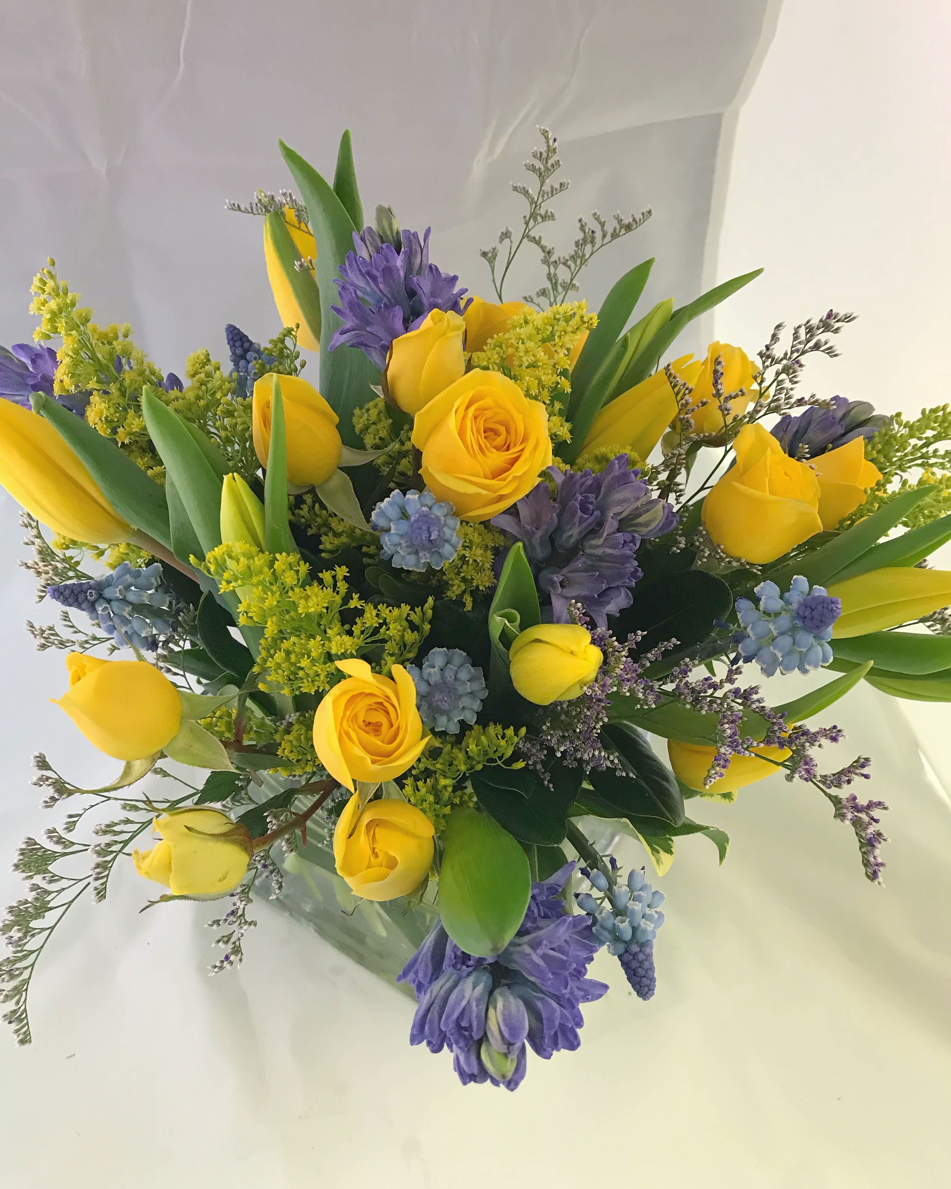 Spring delight - This spring arrangement in square vase also could be colors of your choice: with pink, purple or other! Just let us know and write it under 'Florist Instructions'!  It includes:  10 tulips 5 hyacinths 3 stems spray roses and filler 
