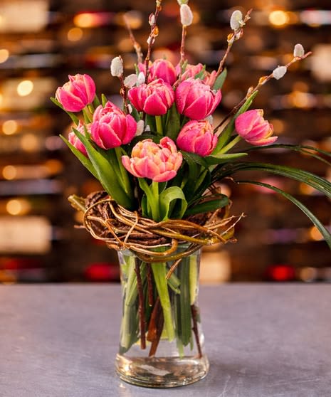 Whispering Tulip Nest- Assorted Colors - *Color of tulips will vary based on availability. If you would like a specific color please call (574) 722-1155   A timeless favorite that captures the beauty of the season, our tulip arrangement features fresh, vibrant blooms thoughtfully designed in a classic vase. Simple yet elegant, this piece brings a cheerful pop of color to any space—perfect for celebrating spring, brightening a home, or gifting someone special. Tulip colors may vary based on availability, ensuring each arrangement is uniquely beautiful.