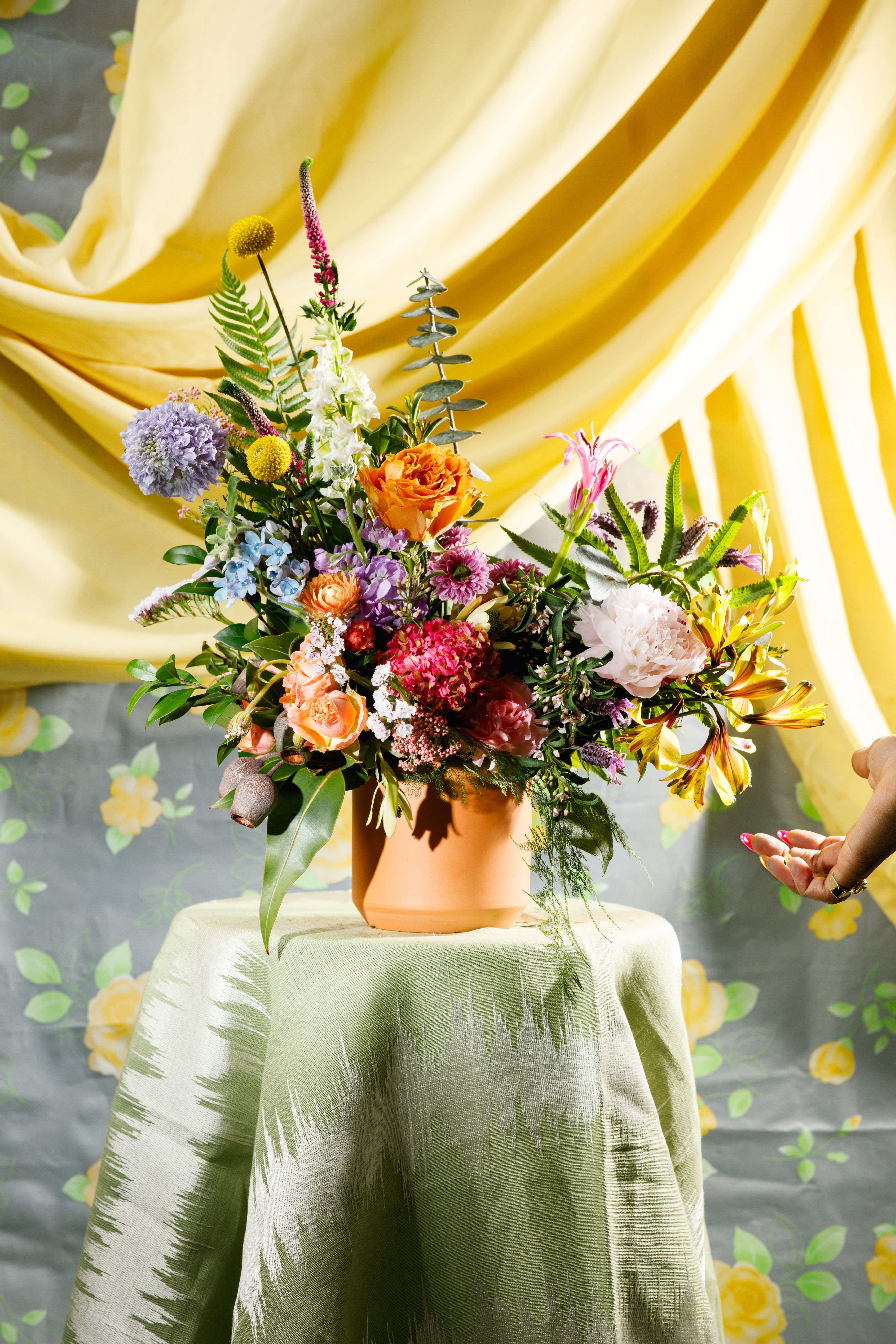 Bed-Stuy Collection: The Halsey , Spring/Summer Edit  - “The Halsey” is our medium, low &amp; lush, floral arrangement created in one of our hand-picked ceramic vases. It is the perfect size for any space with a small tabletop or a home office with a medium-sized desk. Let one of our designers create an arrangement using our freshest picks of the week.   **Please note that Brooklyn Blooms move with the seasons, vessels, blooms, and foliage will vary from what you see in the photo. However, it will have the same beauty, uniqueness, and funky style. Please let us know in the florist notes if you have any color preferences or special requests. If you like what you see in the photo please let us know in the florist notes and the designers will use it as inspiration. Otherwise, the Bloomies will make a tasteful decision for you!**  ***ALL SPECIAL REQUESTS MUST BE SPECIFIED IN THE FLORIST NOTES SO THAT OUR BLOOMIES ARE AWARE AND CAN DELIVER THE BEST SERVICE. COMMUNICATION IS KEY!!****  Upgrade Notes: Please note that with each upgrade the Bloomies will choose a mix of blooms, premium foliages, and filler to enhance your arrangement for the best presentation!  