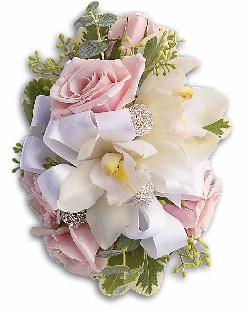 Corsage of white orchids and pale pink roses with white ribbon accents.