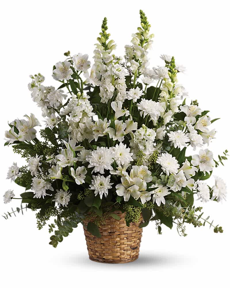 Tall all-white flower basket with alstroemeria, mums, and snapdragons in a woven container