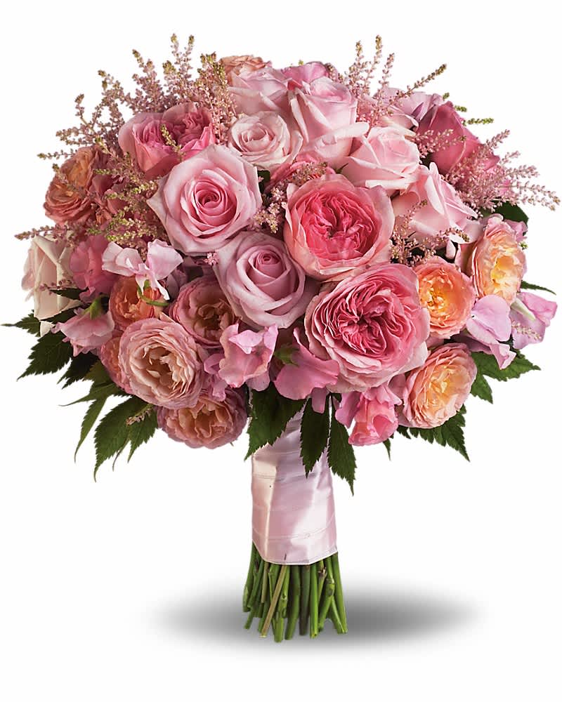 Hand-tied bouquet of pink and peach roses wrapped with pink satin ribbon