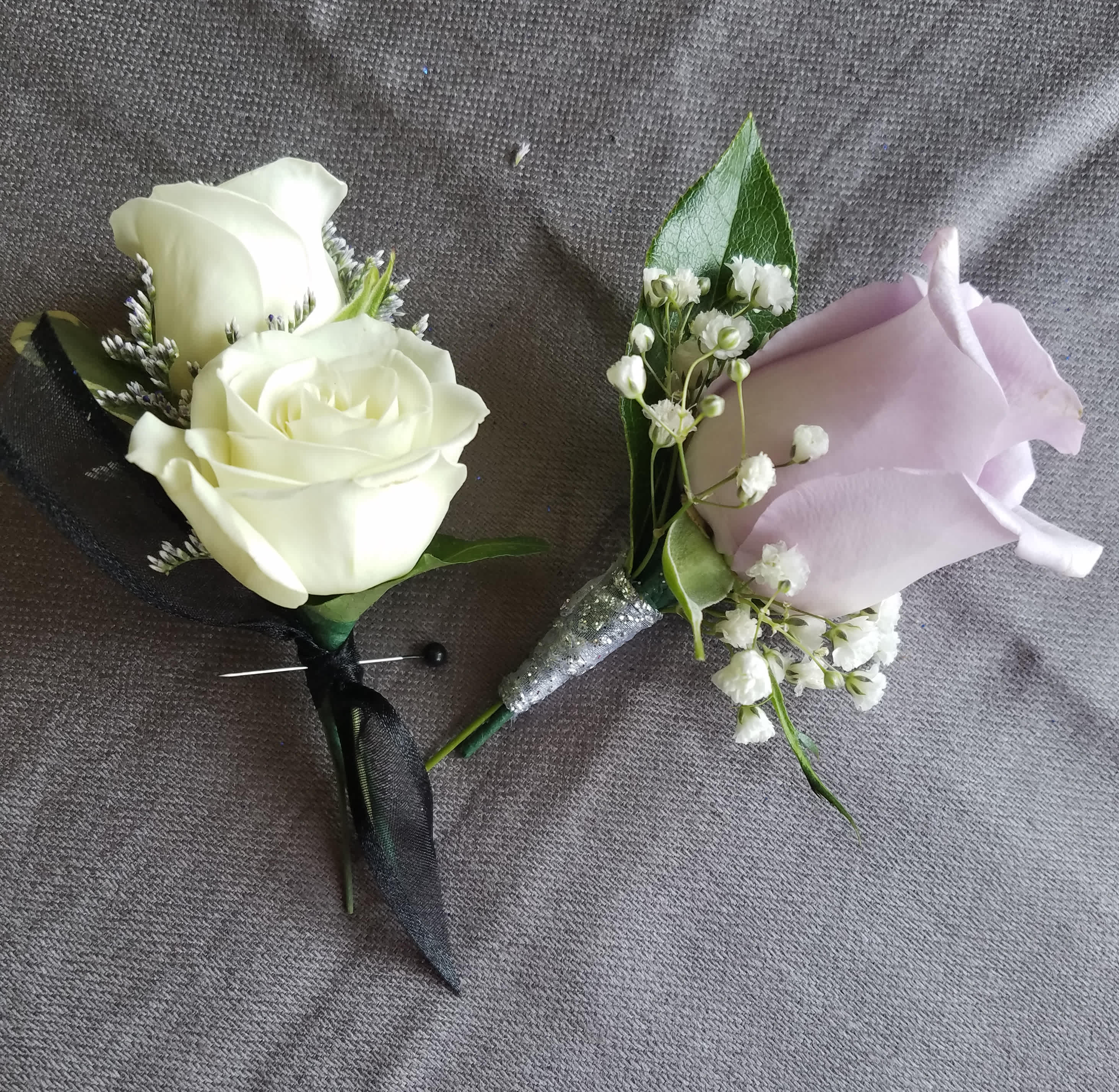 Rose Boutonniere standard - This boutonniere has either 1 standard sized rose or 2 spray roses of common colors with greens and filler. We have all sorts of ribbon from lime green sparkle to animal print, just tell us in the special instructions what your looking for! You may also send us a picture of the dress or inspirations to our email address lvfloral@gmail.com just make sure to include your name and order number.    ALL corsage/boutonniere orders will be ready for PICK UP ONLY between 1pm-4pm the day of the event. 