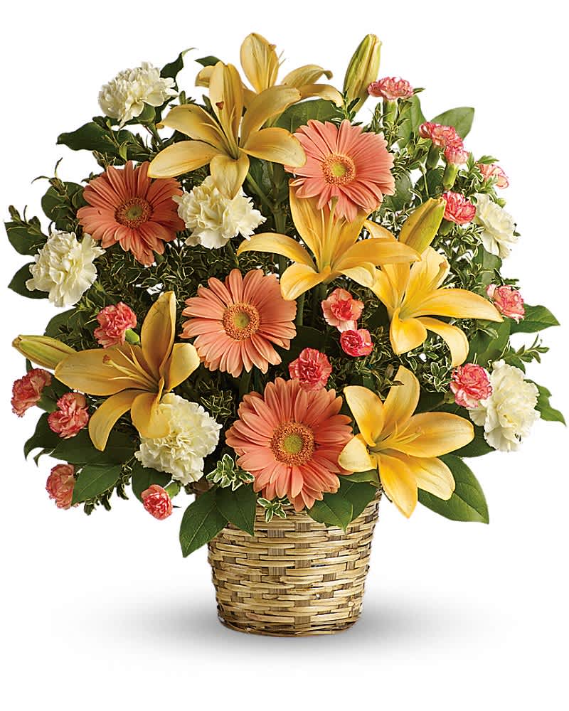 Basket arrangement with yellow lilies, peach gerbera daisies, white carnations, and pink mini carnations