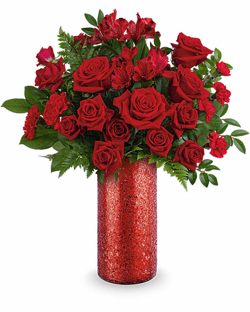 Tall arrangement of red roses and red accent flowers in a sparkling red cylinder vase
