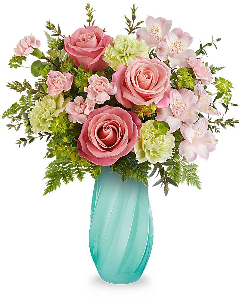 Pastel pink roses, green carnations, and pink alstroemeria in a teal glass vase