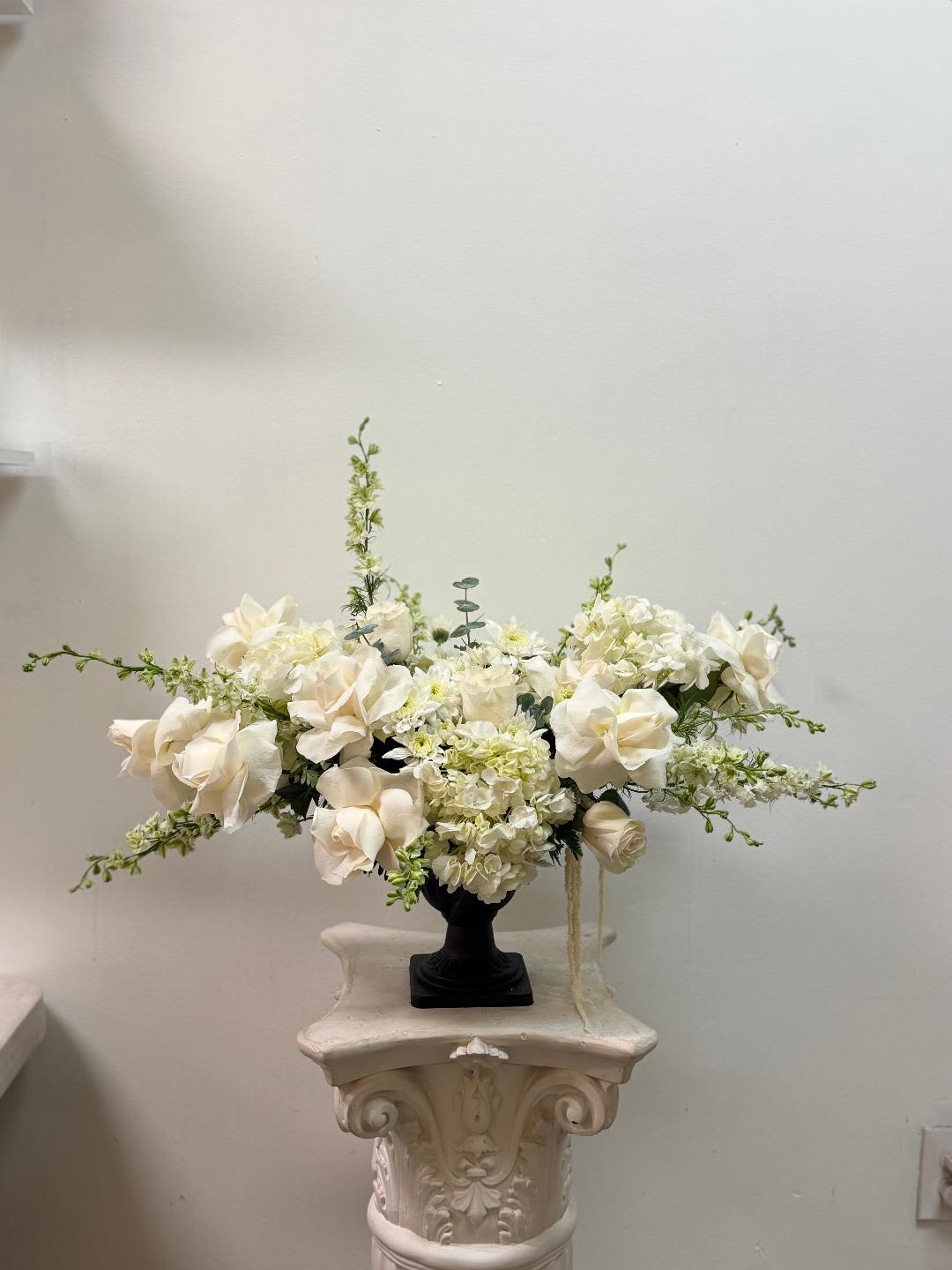 Joyful  - Made from fresh flowers, a corsage looks like a petite flower arrangement (typically consisting of just one or several smaller blooms) and usually sits on the wrist like a bracelet, though it can also be pinned on a lapel. Corsages serve as a way to honor people who are very important to the couple getting married. Please contact our shop at (747) 249-4678 for any customization. 