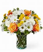  "Citrus Breeze Bouquet" - Fresh, Bright, and Full of Joy!  The Citrus Breeze Bouquet is a lively mix of orange roses, sunny yellow poms, and crisp white daisies, all beautifully arranged in a clear glass vase. It’s like sending a fresh breath of spring sunshine — perfect for brightening any day!   Fresh, hand-picked seasonal flowers  Perfect for birthdays, celebrations, or just because  Vase included — ready to enjoy!   Light up their day with a vibrant burst of color and happiness!