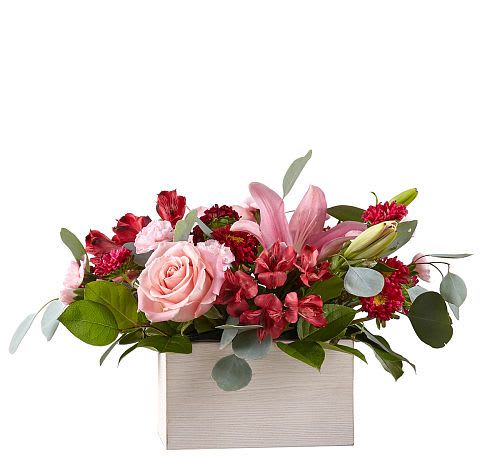 Head Over Heels Bouquet - Timeless blooms and classic Valentine shades create the Head Over Heels Bouquet. The moment this arrangement arrives and the fresh fragrance of lilies, roses  fills the air, your special someone will be reminded of all the reasons they fell for you in the first place.