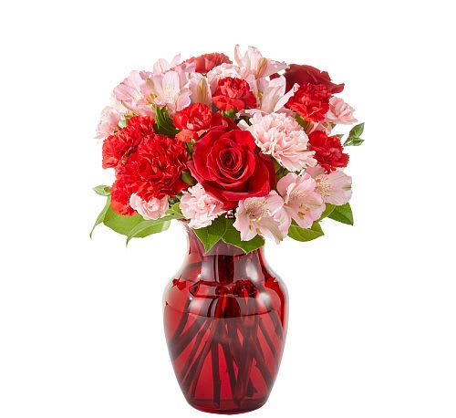 Candy Kisses Bouquet - Sweeten their day with Candy Kisses Bouquet! A delightful mix of red roses, pink alstroemeria, and vibrant carnations create a heartwarming display of love and affection. Arranged in a ruby-red glass vase, this charming bouquet is the perfect way to send a kiss of sweetness for any occasion!