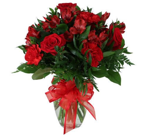 Passion - Passionate arrangement of all red flowers featuring lush red roses, ample red alstroemeria and red carnations with added greenery and matching red bow.