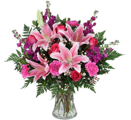 Dream Come True - This arrangement is every girl's dream come true! Stunning stargazer lilies, pink roses, pink carnations and purple stock make up this gorgeous arrangement. beautifully presented in a glass vase!