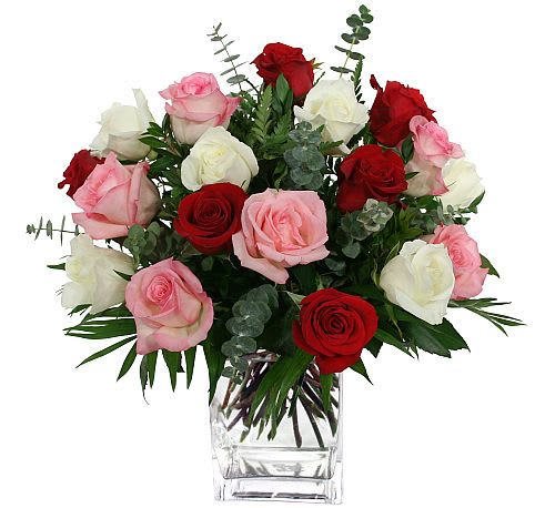Exceptional Roses - Leave her speechless with this luxurious bouquet of 18 mixed colour roses, elegantly arranged in a glass cubed vase with added greens. Colours include red for love, white for purity, and pink for gratitude and respect.
