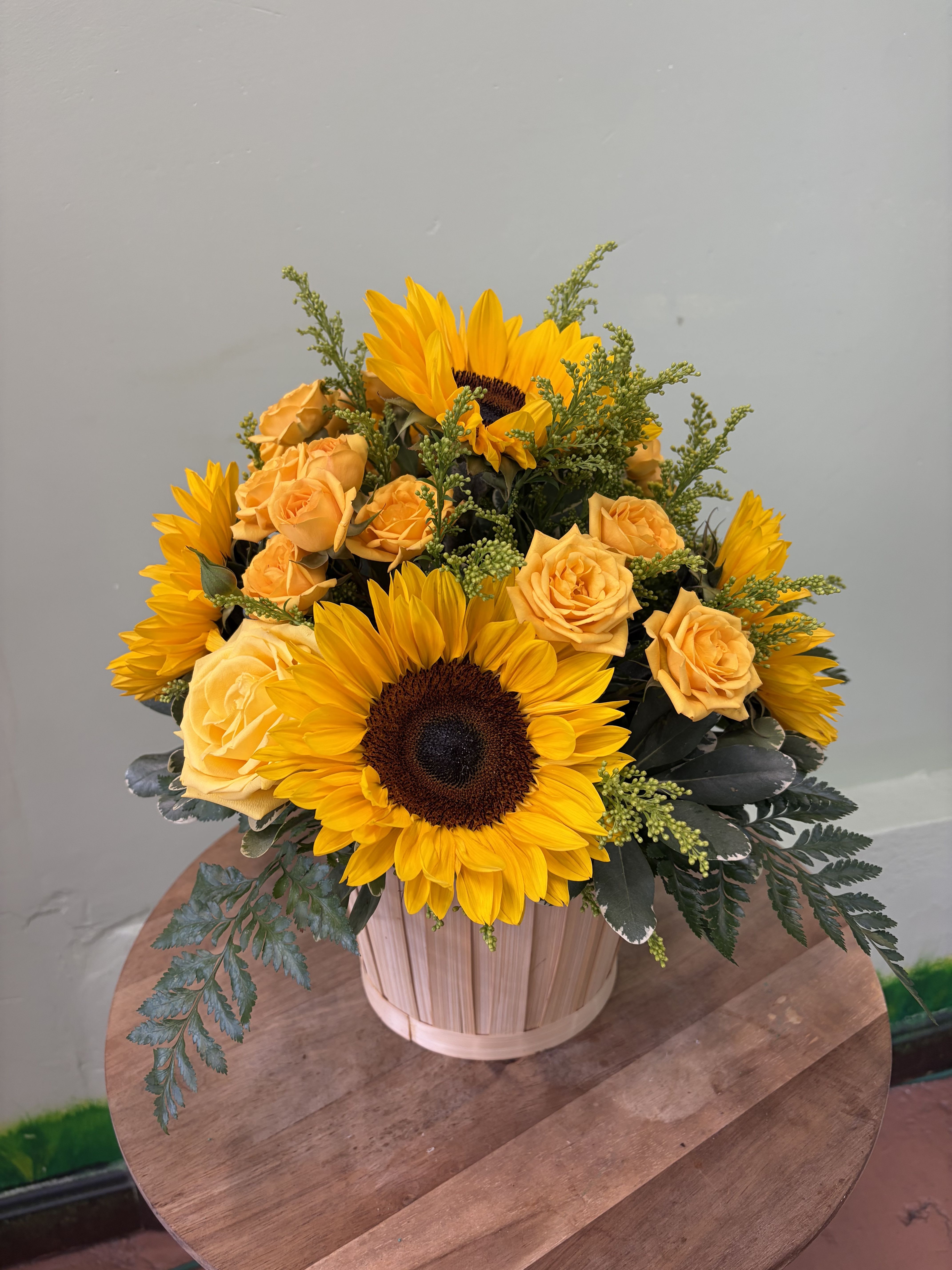 Golden Sunshine Basket - A bright and cheerful arrangement with warm yellow tones and lush greenery, perfect for adding a touch of happiness to any space. 