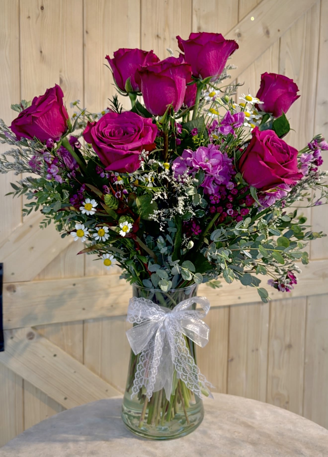 Catalina Island - Featuring BLUEBERRY ROSES  An arrangement like you’ve never seen before. Unique blueberry (deep purple/slightly mauve pink tone) roses for an occasion to make the day. 
