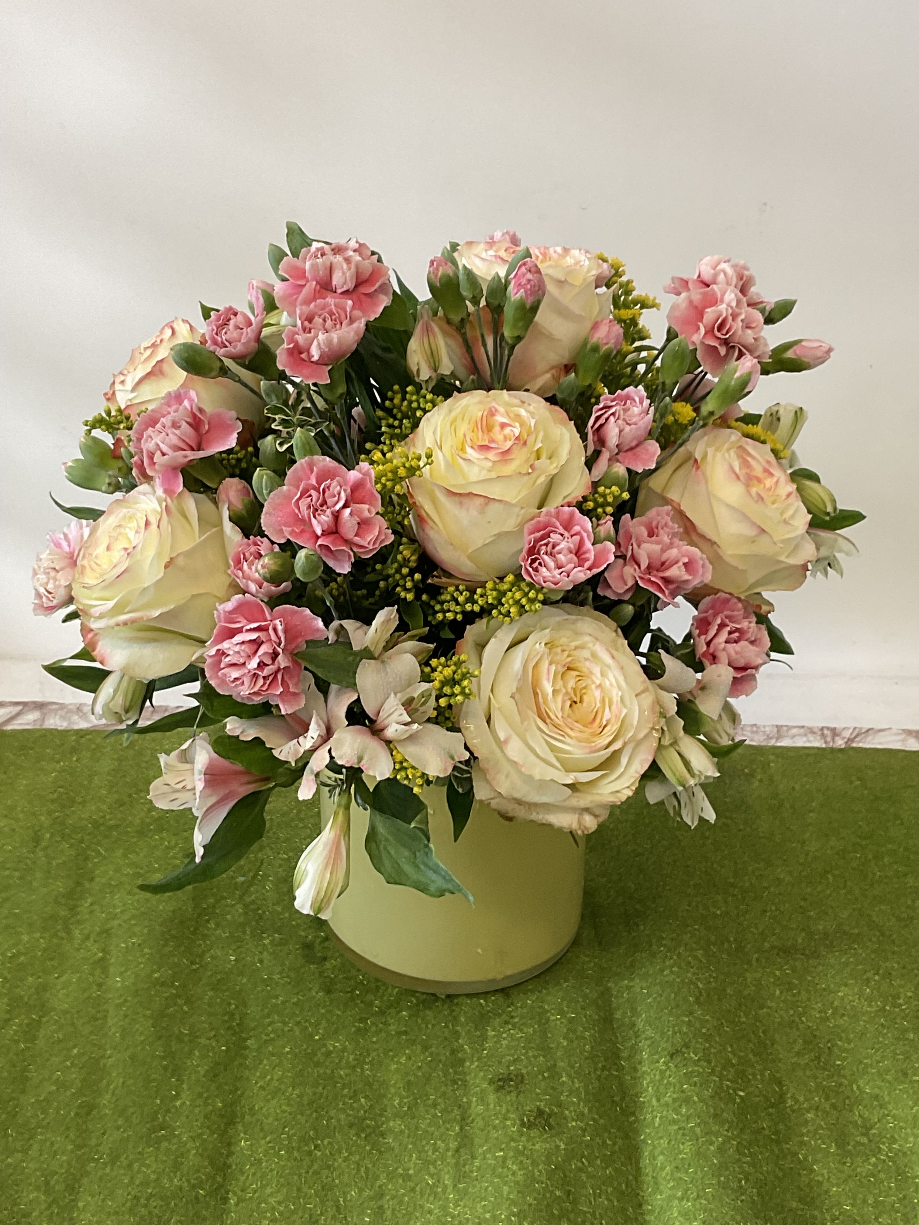 26-108 - Bright mixed blooms in fresh seasonal colors, thoughtfully arranged for a cheerful, elegant touch to any room.
