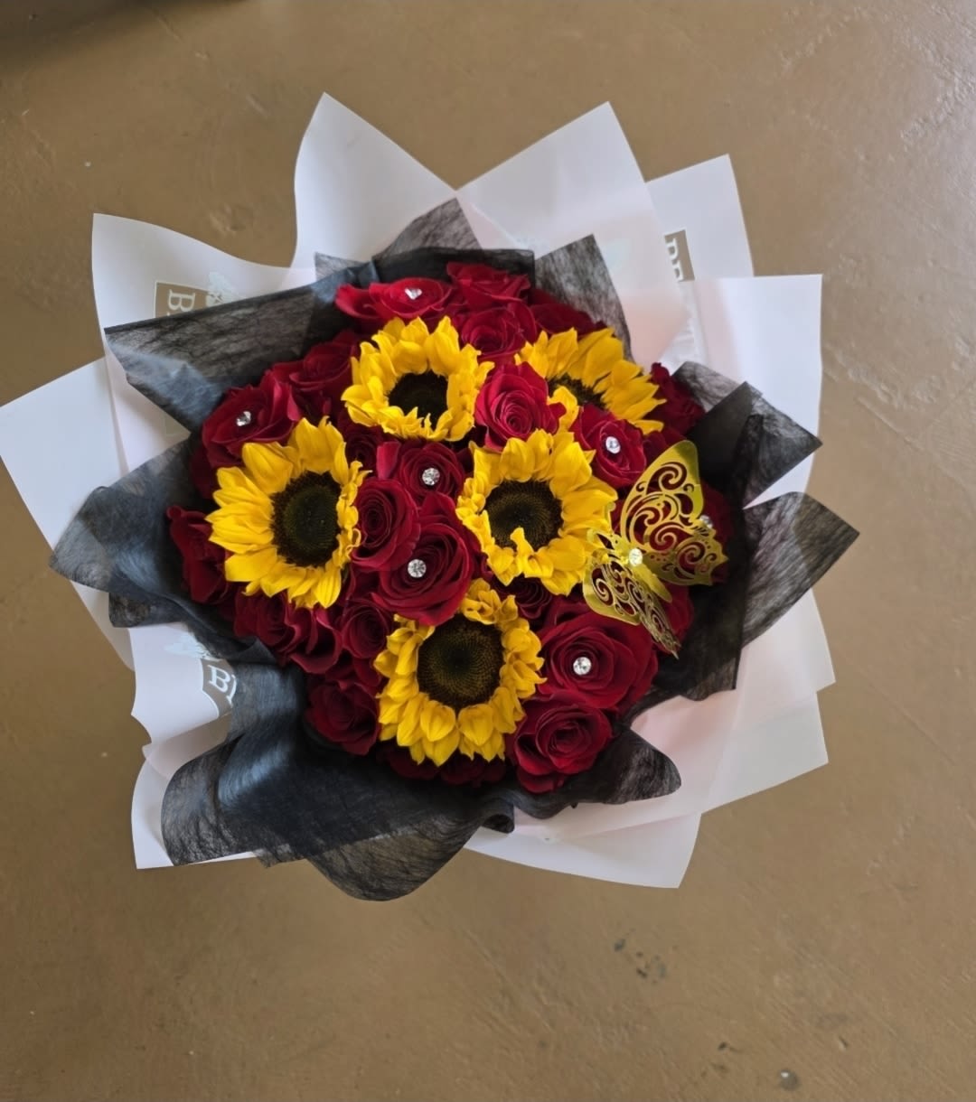 Sunshine Passion Bouquet - A beautiful mix of red roses and bright yellow sunflowers for any occasion   