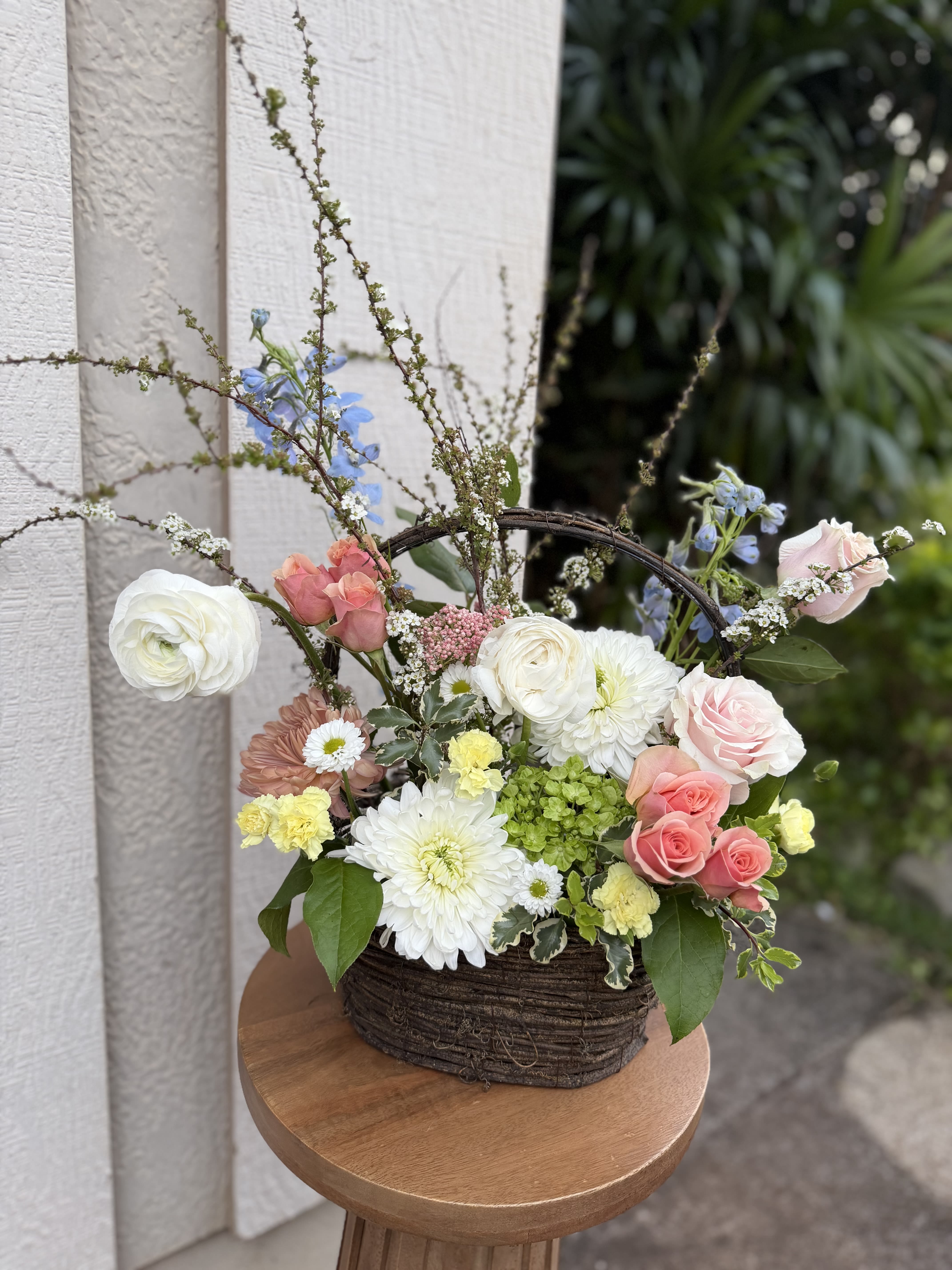 April Blooms - A sweet assortment of spring pastels including roses, mums, ranunculus, Spirea, and more 