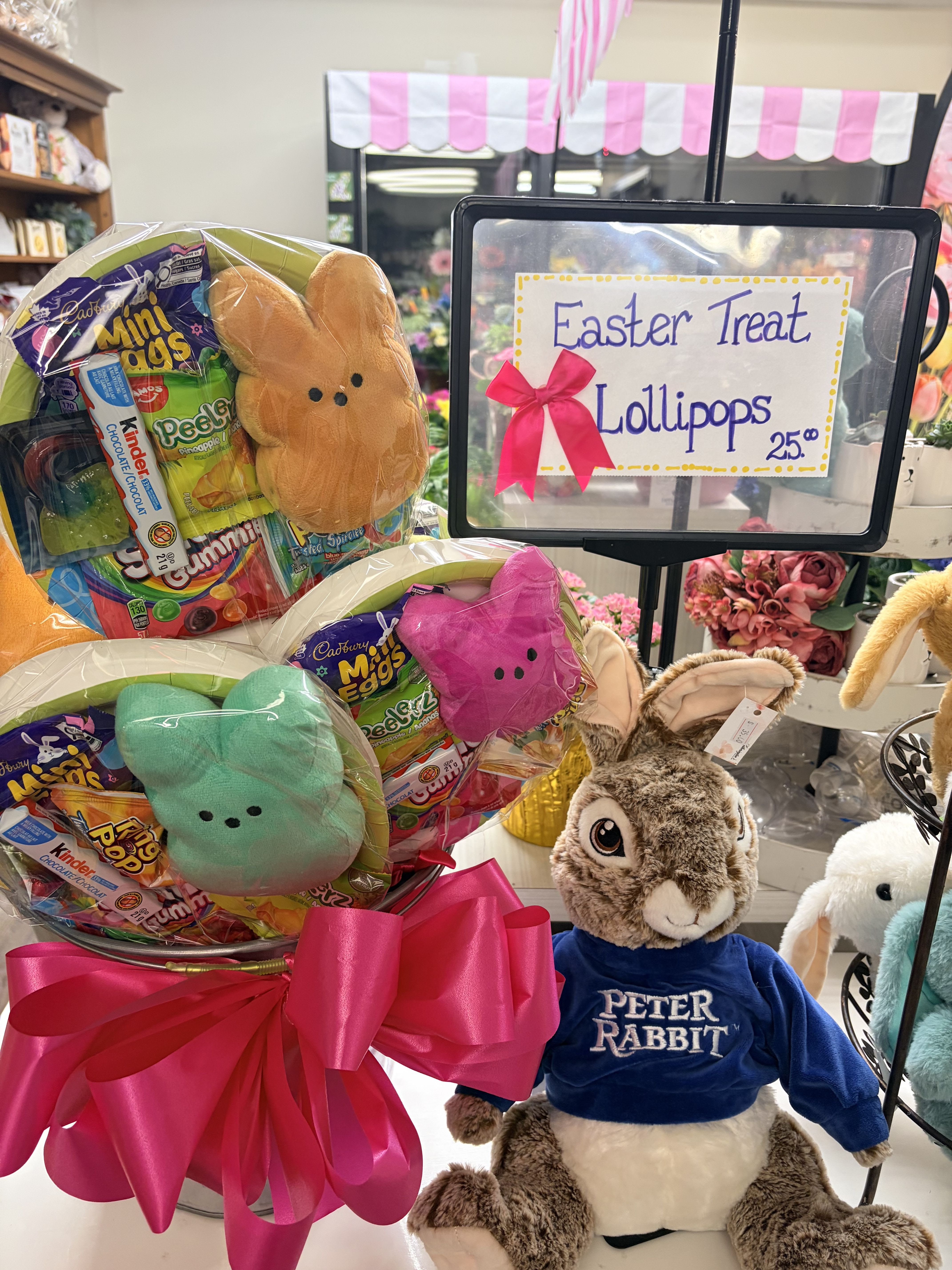 Easter Treat Lollipop Only 3 available!!  - Sweeten up Easter with something extra special at Lotherington’s Flowers!  Our NEW Easter Treat Lollipops are here and they’re as fun as they are delicious. Each one is packed with a cuddly stuffed peeps bunny and a colourful mix of favourite goodies, perfect for kids, grandkids, or anyone who deserves a little Easter surprise! Bright, cheerful, and ready to gift, these make the perfect addition to any Easter basket, add-on to any bouquet or make a sweet stand-alone treat. Hop in while they last…