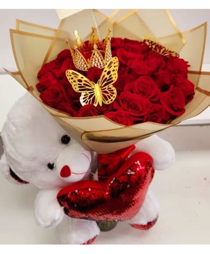 LOVE AND ROMANCE WRAPPED BOUQUET  -   Make an unforgettable statement with this grand bouquet of 24  Red Roses &amp; Medium Bear The perfect gift for expressing deep love, passion, and admiration, this bouquet is designed to impress on any special occasion. Standard: 24  Roses. Deluxe:36 Roses. Premium: 50 Roses. 