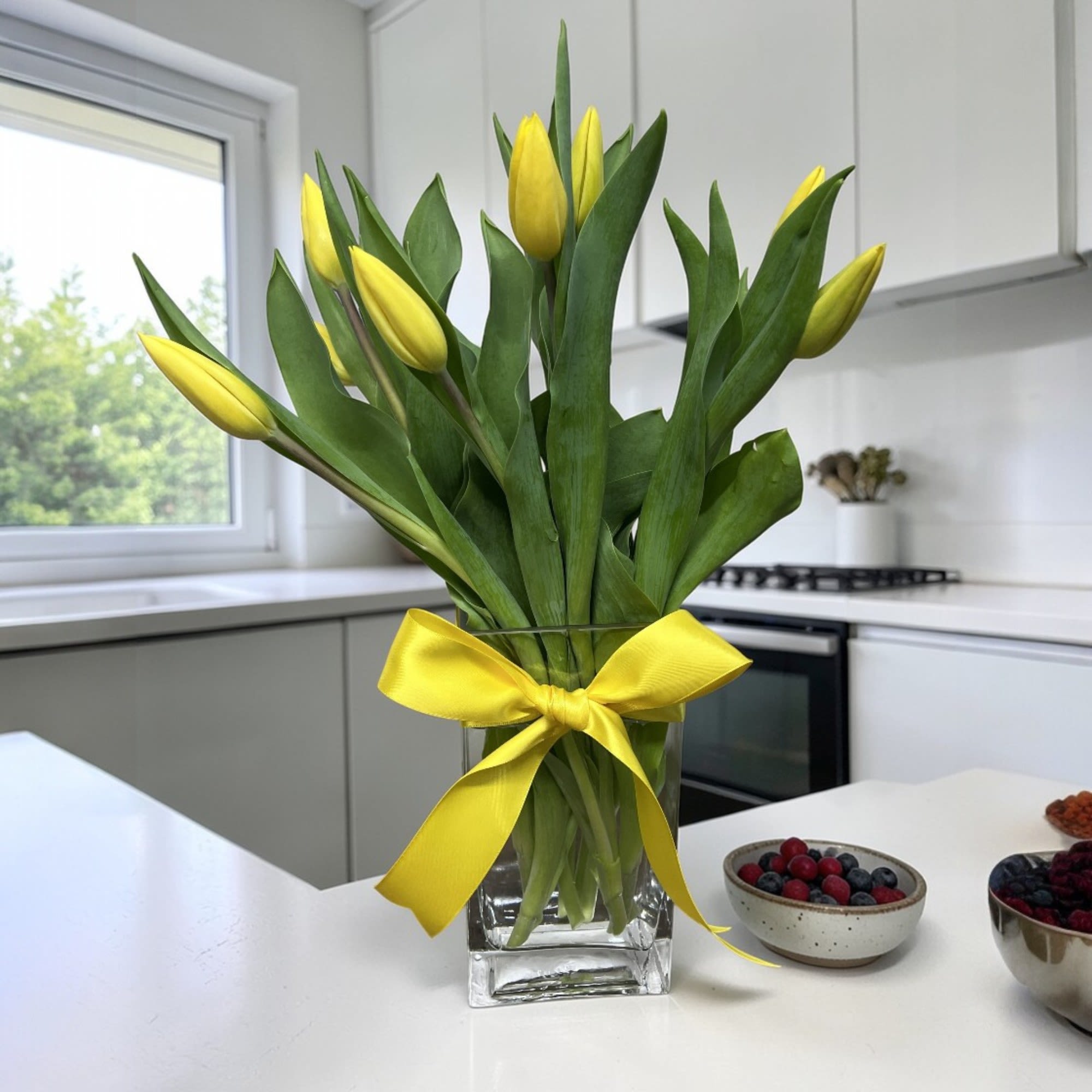 Tulip Simplicity - Class up your décor this spring with this simply chic tulip arrangement in a quality geometric vase.