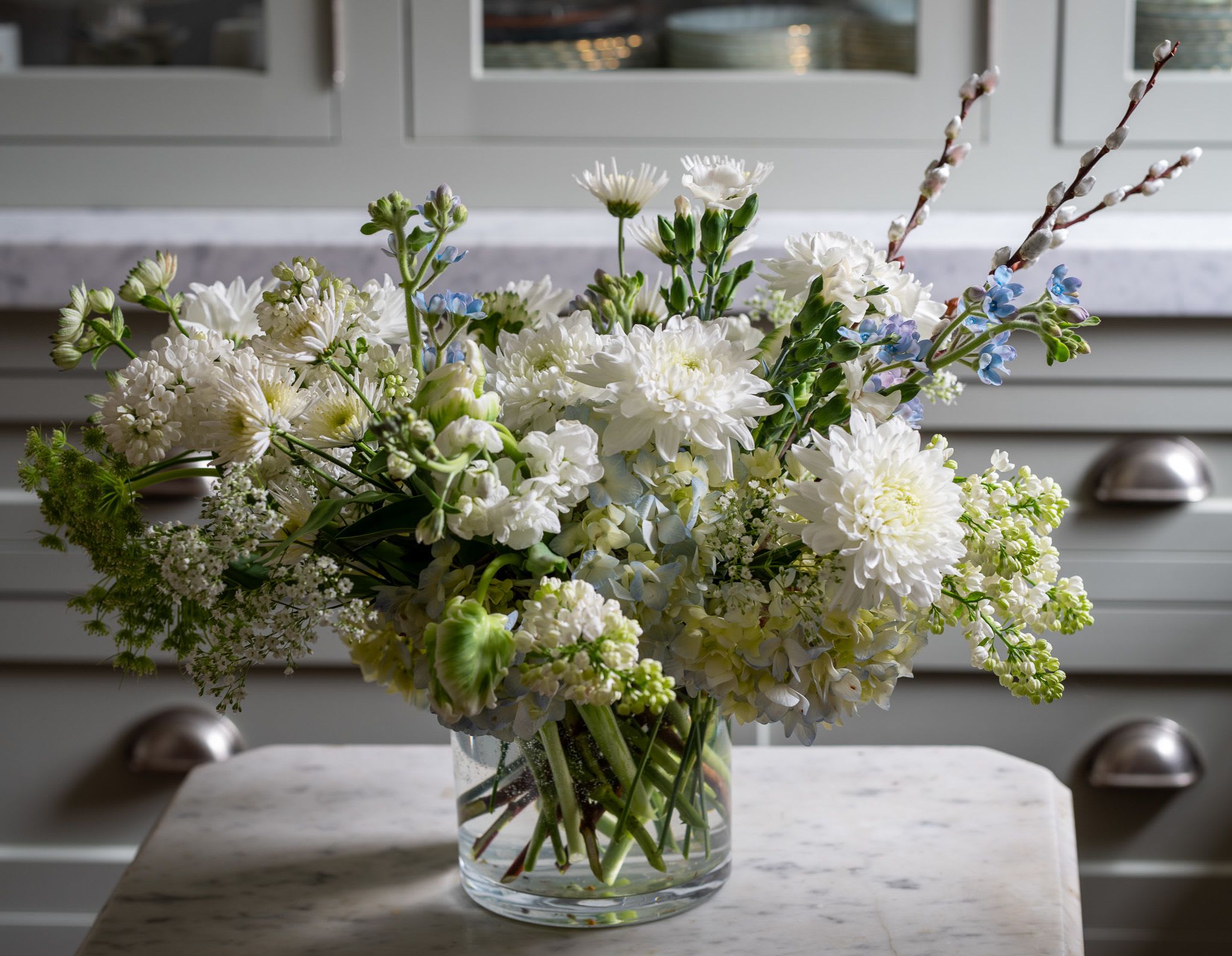 Timeless - Timeless and classic in white and green a beautiful low standing centerpiece perfect for a dining, or side table or desk.