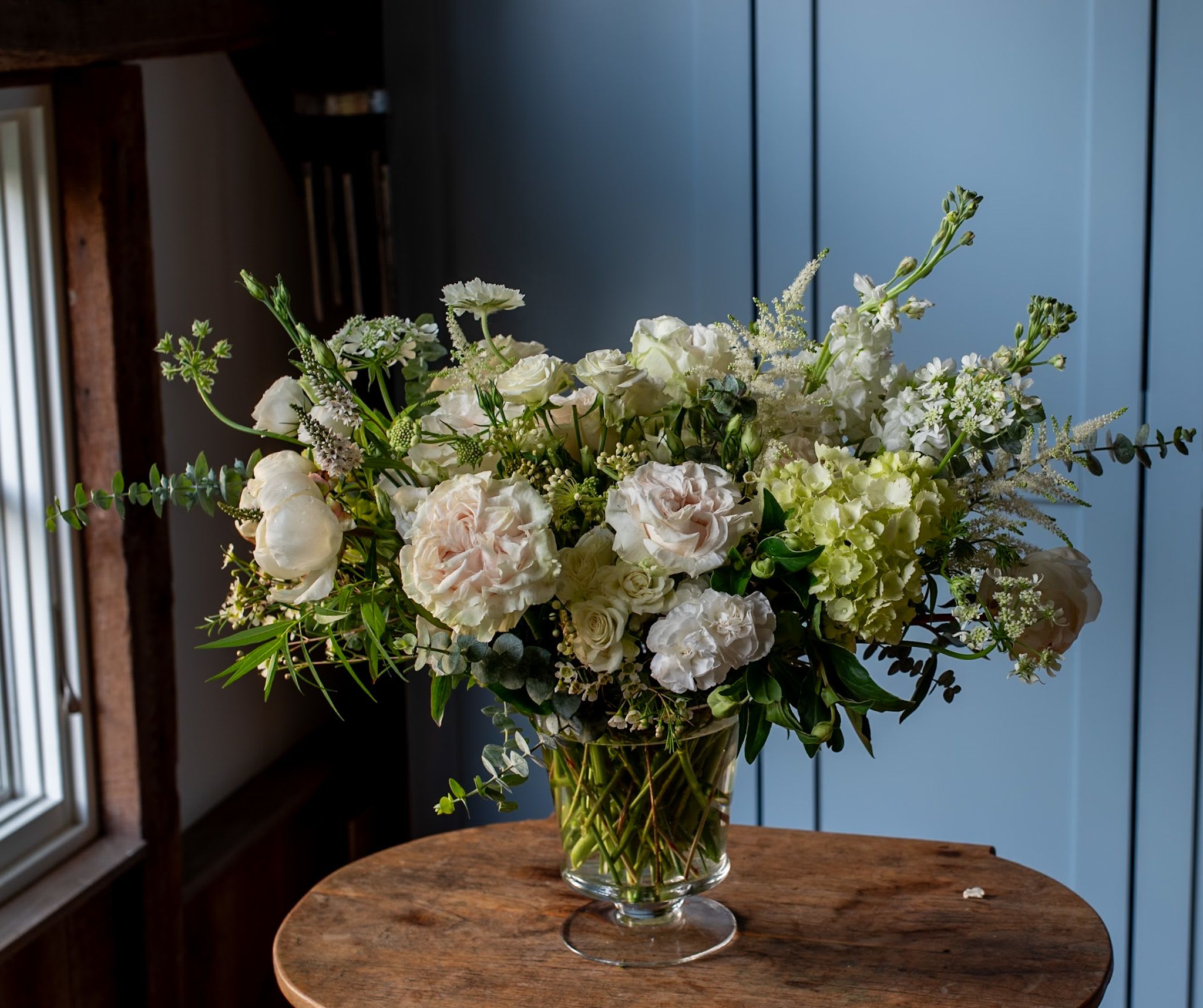 Dreamy Roses and Hydrangeas - Beautiful roses, hydrangeas, stock, lisianthus all together create a timeless classic floral design.  This design is tall and perfect for a foyer, kitchen island, or any place to bring joy.  