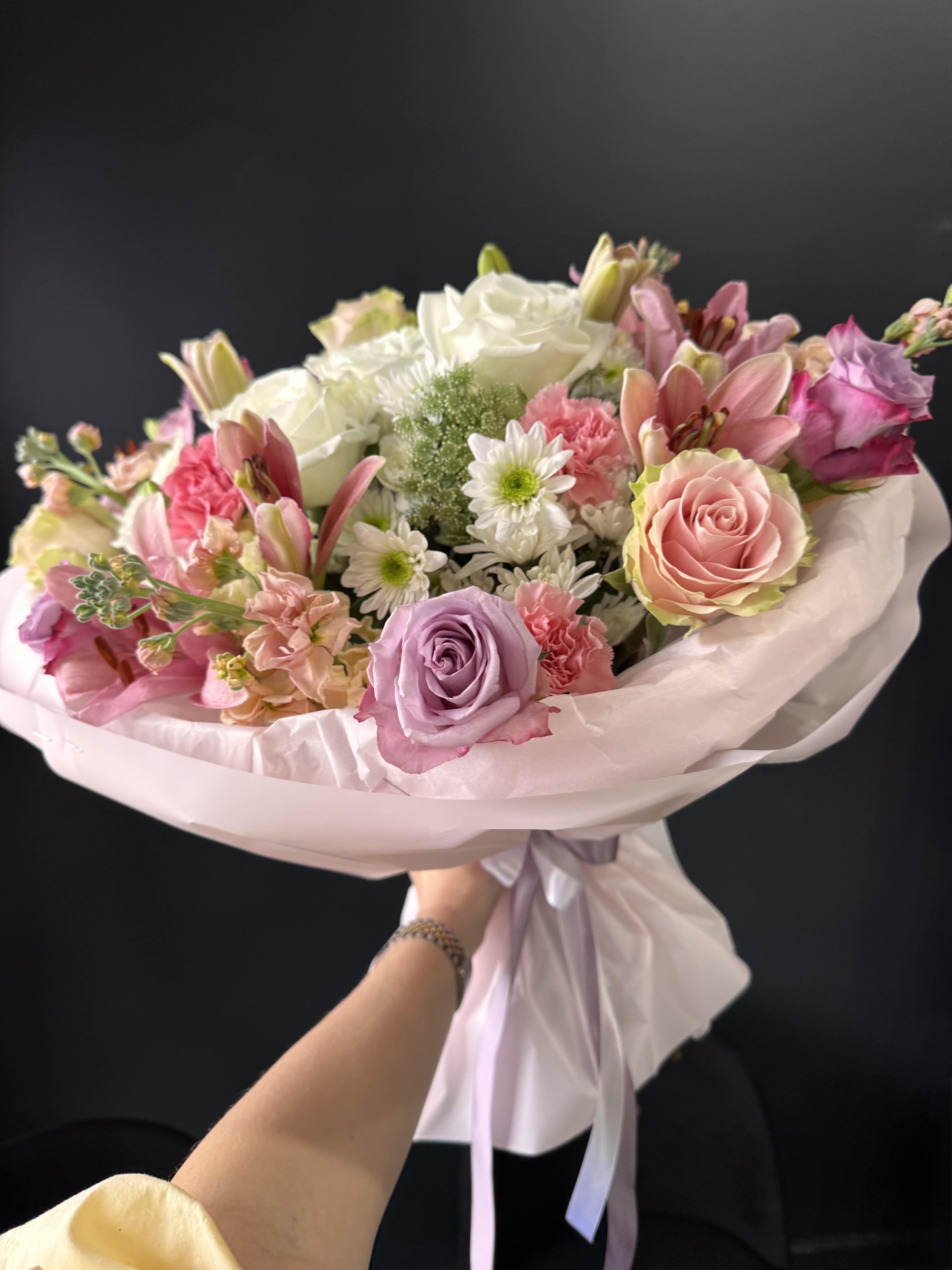 Blush Whisper Elegance - Blush Whisper Elegance is a voluminous, delicately balanced arrangement in shades of soft pink and crisp white. Crafted with premium roses and carefully selected seasonal flowers, it offers a luxurious, cloud-like texture and a naturally flowing shape. This bouquet feels both sophisticated and emotional — perfect for meaningful gestures, celebrations, or simply to impress with understated beauty.