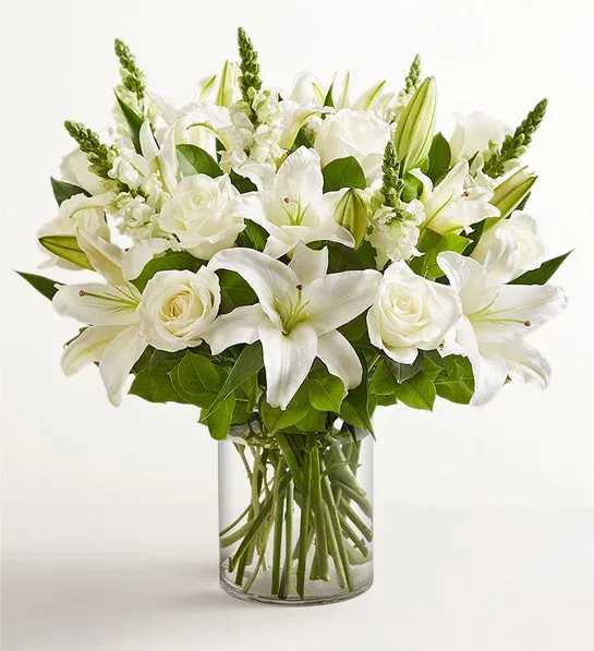 Classic All White Arrangement for Sympathy - White flowers have a timelessness and elegance that brings comfort during life’s difficult moments. Hand-gathered by our caring florists with touches of lush greenery, this classic arrangement beautifully conveys your heartfelt condolences.