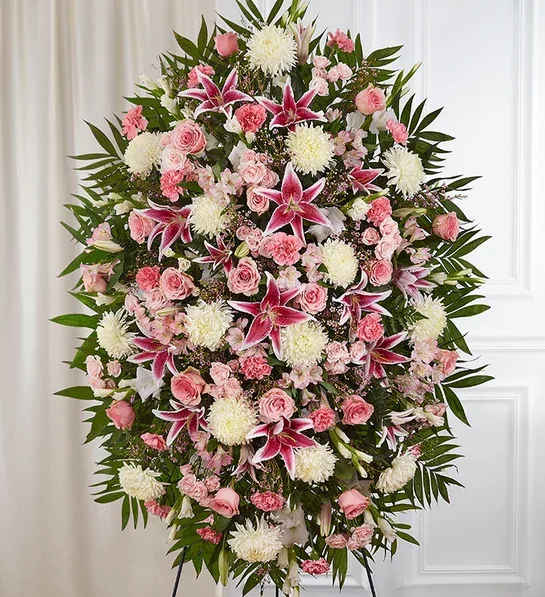 Pink &amp; White Funeral Standing Spray - The warmth and kindness they showed will live on forever, and sometimes this sentiment is best captured through flowers. Our classic standing spray arrangement is elegantly crafted with soothing pink and white blooms for a lush, full presentation, creating a truly memorable tribute to someone so loved.