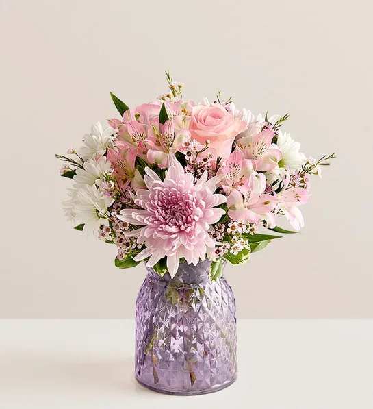 Amazing Mom Bouquet - NEW Inspired by the beauty of a blooming backyard garden, our bouquet is as amazing as Mom. Our florists arrange roses, alstroemeria, and other blooms in a lavender vase that accentuates the beauty of the pink petals.
