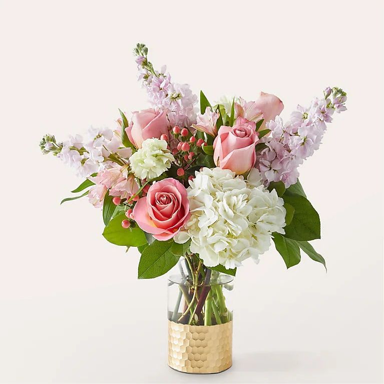 Little Luxuries - This beautiful arrangement consists of roses, stock, alstroemeria, hydrangea, and carnations.