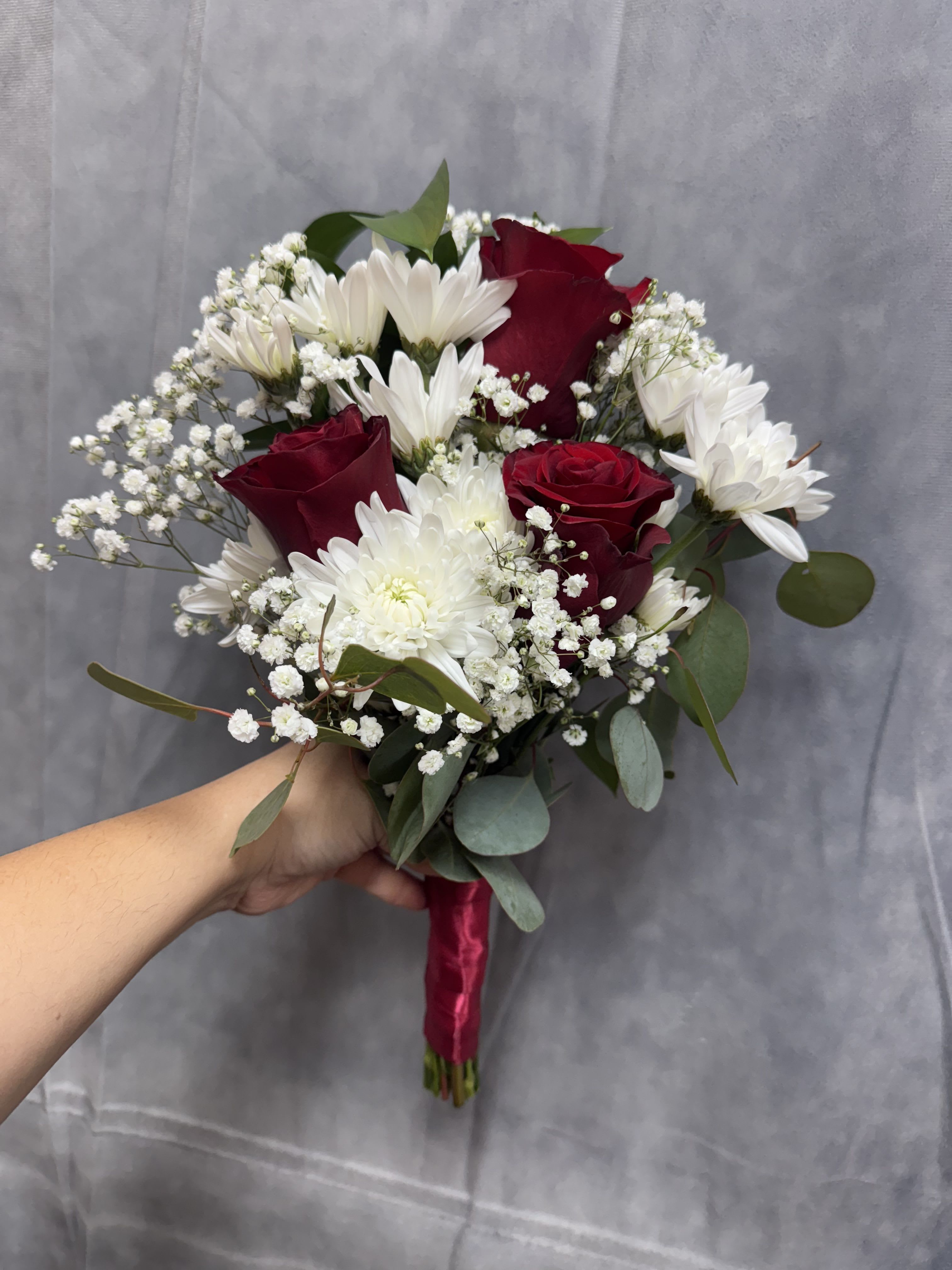 Prom red &amp; white bouquet - Prom red &amp; white bouquet . The bouquet made with red roses , white cushions, baby breath  and greenery.