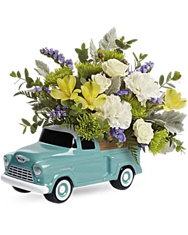 Chevy Trucking Blossoms Bouquet  - Talk about a dream machine! Bursting with a fresh rose bouquet, this sweet, hand-glazed ceramic Chevy keepsake is a fun celebration for any occasion. This arrangement includes white spray roses, yellow alstroemeria, white carnations, green cushion spray chrysanthemums, blue sinuata statice, dusty miller, parvifolia eucalyptus and leatherleaf fern. Delivered in a Chevy Pickup Keepsake. * Arrangement is a small to medium size* 