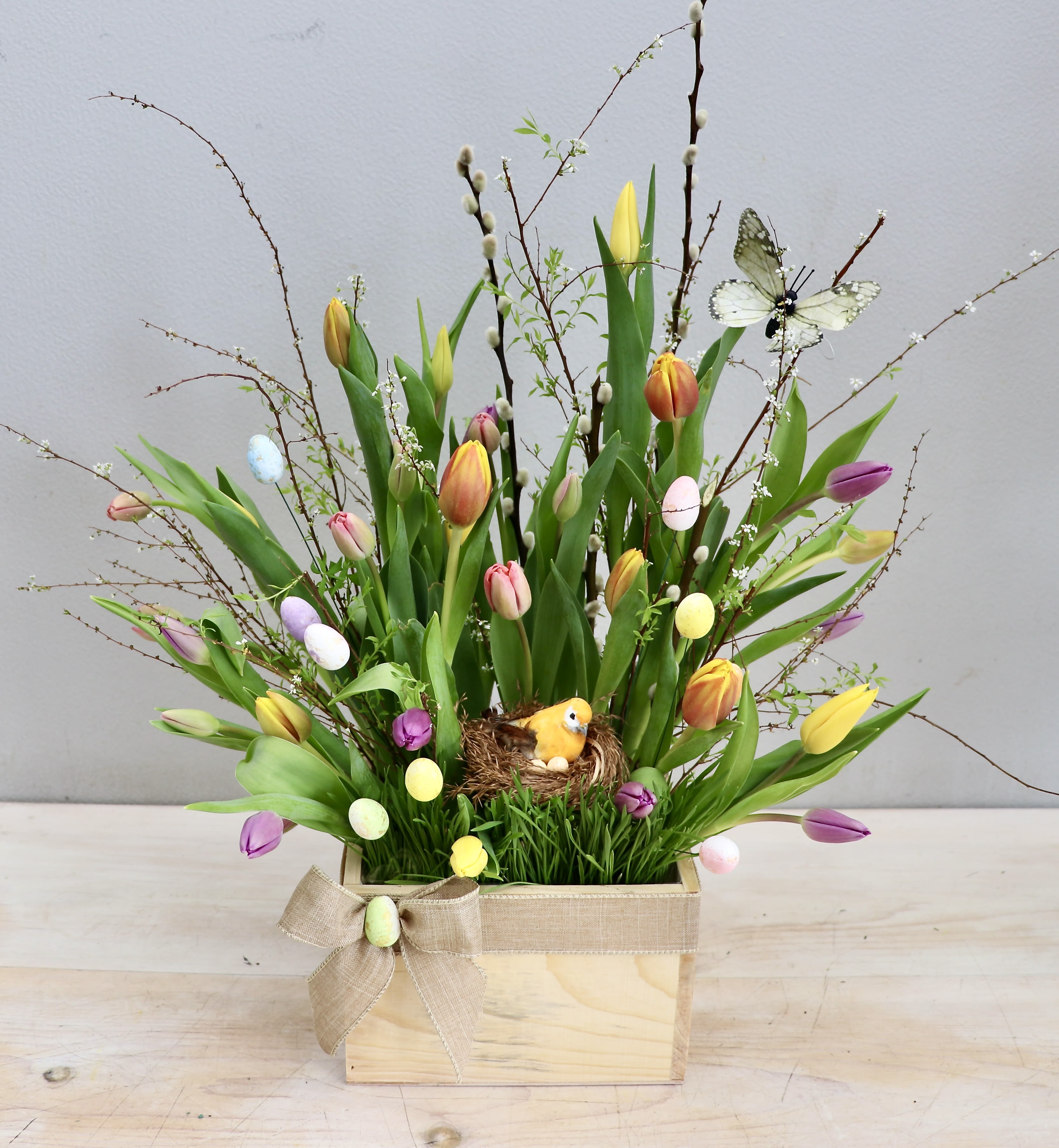 Springtime Bounty - My Glendale Florist  - This arrangement captures the essence of Easter with its vibrant springtime colors, we've paired bright green bells with lush pink lisianthus and fragrant yellow freesias. Don't forget to order in time for Easter! The photo shown is in the standard size, upgrade to deluxe or premium for more blooms. 