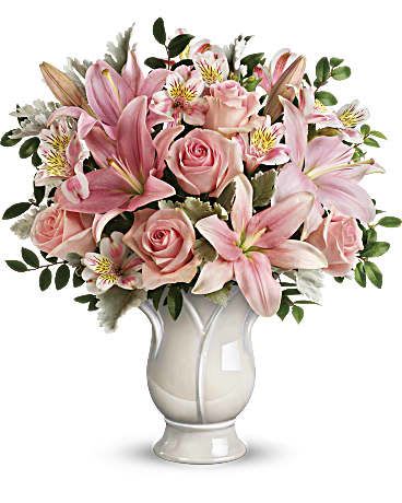 Soft and Tender Bouquet  - Tender as a rose, this soft pink arrangement is a beautifully feminine show of love. Pink roses, pink asiatic lilies, and pink alstroemeria are accented with dusty miller and huckleberry. Delivered in Blooming Tulip vase. 