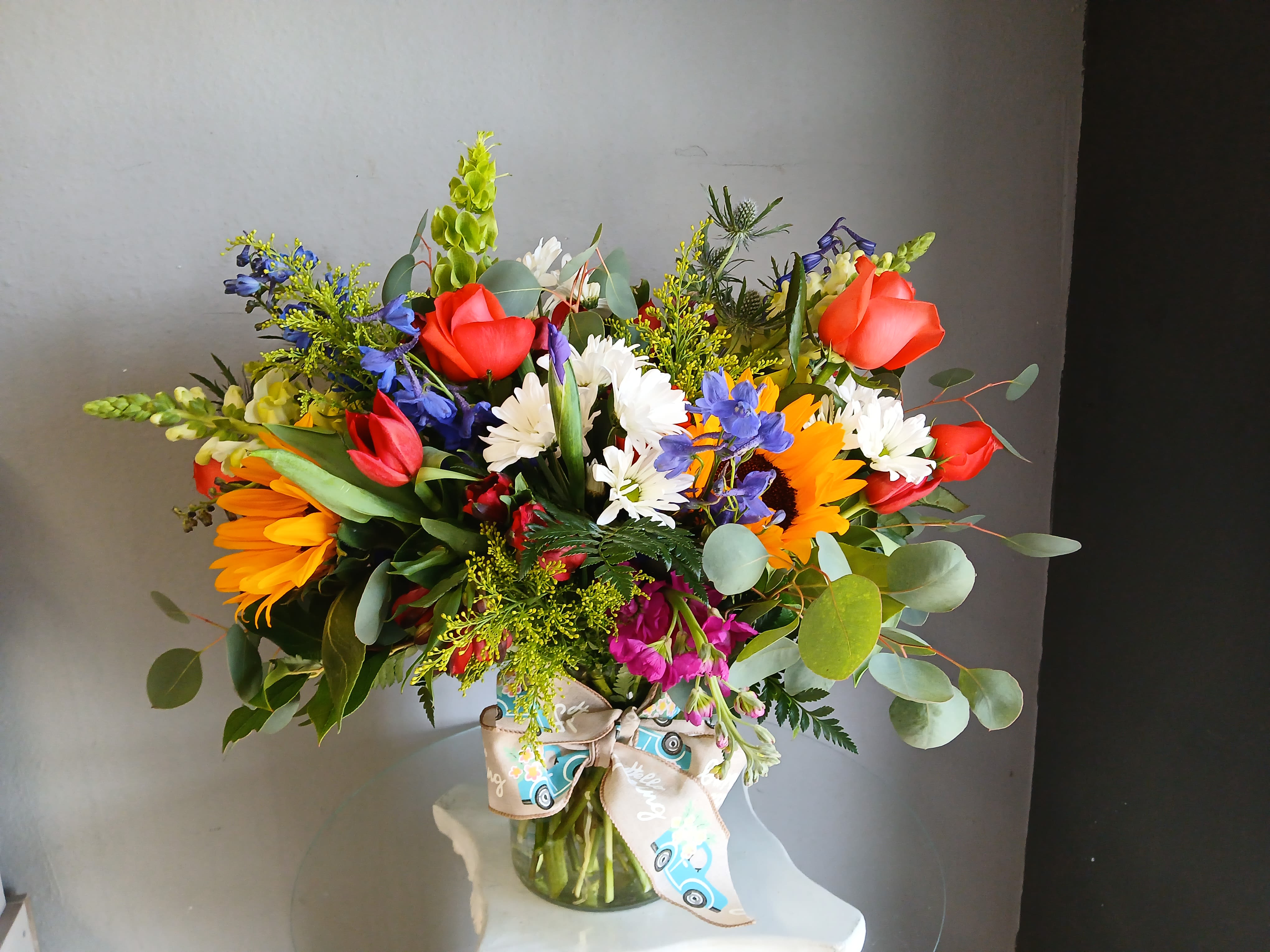 #755 Designer's Choice Vase Arrangement  - This beautiful flower arrangement of fresh mixed seasonal blooms is made by local designers in the heart Orange California. Hand crafted and perfect for every occasion, from birthdays and new babies to sympathy and just because. The best choice to show you are thinking of that special someone. Can be sent as a local delivery or in-store pickup. This is an original, one of a kind arrangement. Order now before it's too late! 