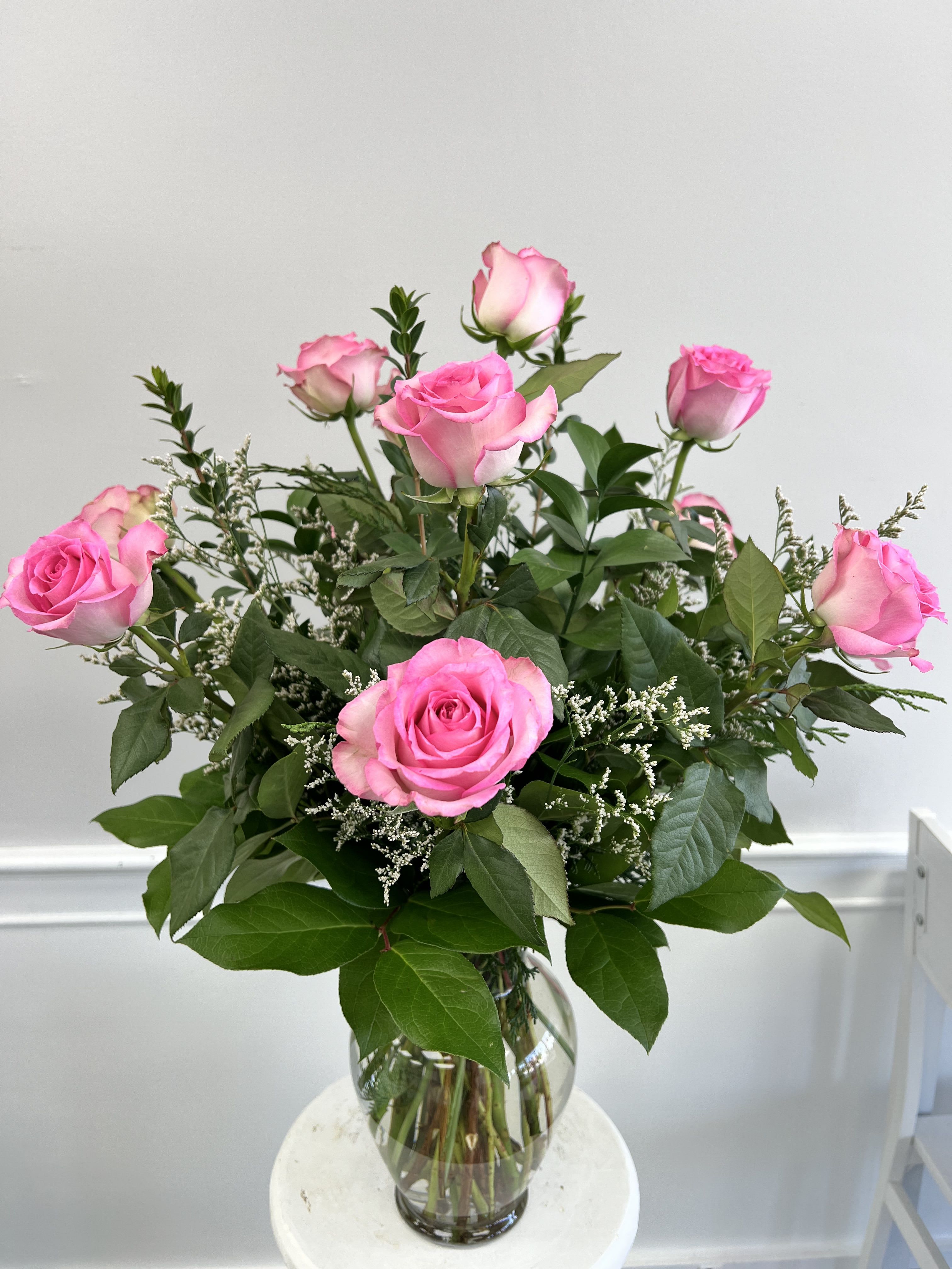 Arrangement of pink roses in a clear glass vase