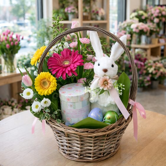 Easter Basket bouqet  - Natural wicker basket with beautiful fresh spring flowers next to a white beautiful bunny, finished off with a candle in glass jar (10oz) Lavender &amp; Woods Scent.