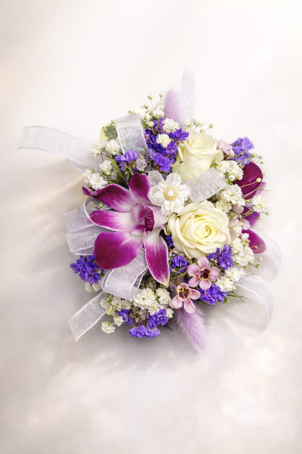 Corsage 8 - This Beautiful corsage made with Purple dendrobium orchid and white spray roses, baby's breath , static  Lavender ribbon, 