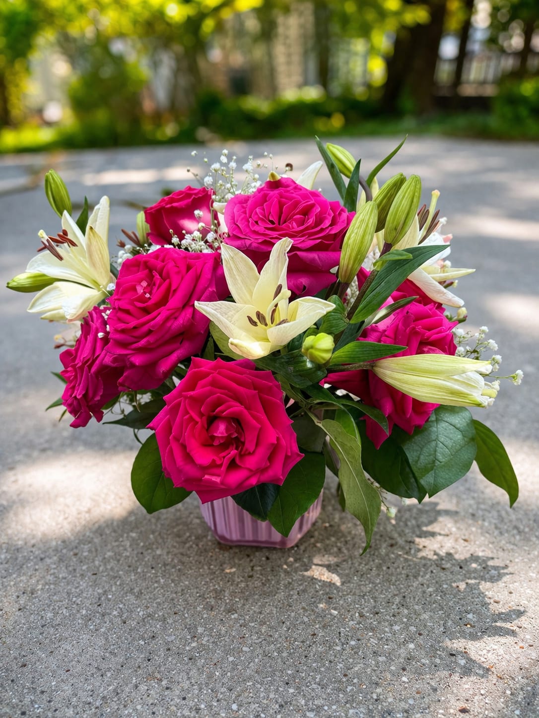 Luxury Pink Rose &amp; White Lily Arrangement in Vase  - Make a lasting impression with this Luxury Pink Rose &amp; White Lily Arrangement, a stunning combination of vibrant pink roses and elegant white lilies designed to capture attention.  This arrangement features premium roses paired with fragrant lilies, accented with baby’s breath and lush greenery, all styled in a modern vase. The contrast of bold pink and soft white creates a sophisticated and timeless look, perfect for celebrating special moments or sending a heartfelt gift.  Ideal for birthdays, anniversaries, congratulations, or sympathy occasions, this arrangement offers both beauty and elegance in one design.  Handcrafted with care by AZ Flowers &amp; Gifts LLC in Alpharetta, GA, each piece is made fresh and delivered with attention to detail.   Premium pink roses &amp; fresh lilies  Elegant modern vase included  Designed for a luxury look  Same-day delivery available in Alpharetta 30022  Designed by local florist AZ Flowers &amp; Gifts