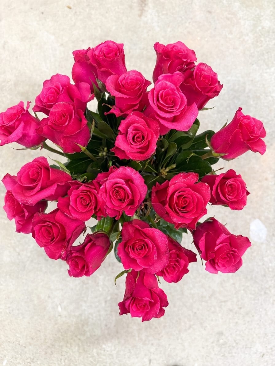 Two Dozen Pink Roses Bouquet – 24 Fresh Premium Roses in Vase  - Make a grand statement with this stunning Two Dozen Pink Roses Bouquet, featuring 24 fresh premium roses beautifully arranged in a classic, full design.  This luxurious arrangement showcases vibrant pink roses complemented by fresh greenery, creating a rich, elegant look that feels both timeless and impressive. The soft pink tones symbolize admiration, gratitude, and love—making this bouquet perfect for anniversaries, birthdays, celebrations, or romantic gestures.  Designed in a rounded, full style and arranged in a vase, this bouquet is ready to display and enjoy the moment it arrives.  Handcrafted with care by AZ Flowers &amp; Gifts LLC in Alpharetta, GA, each arrangement is made fresh to ensure quality and beauty.  24 premium pink roses (2 dozen) Full, luxurious presentation Elegant greenery accents Vase included Same-day delivery available in Alpharetta 30022 Designed by local florist AZ Flowers &amp; Gifts 