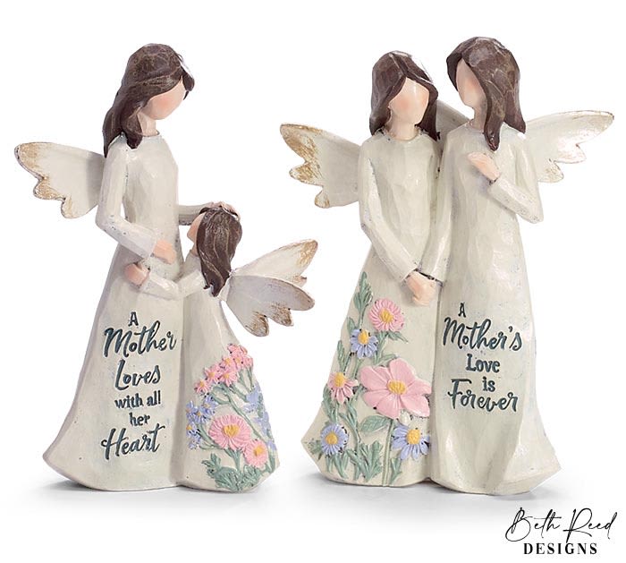 Two angel mother-and-child figurines with engraved sayings and pastel flower details on their dresses.