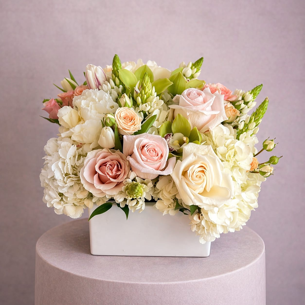 Maribella - A bright mixture of blooms in a wood box is always a perfect gift.  Hydrangeas and roses combined to make a delightful arrangement.  Perfect for a birthday, anniversary or something special for Mom.