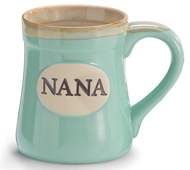 Mint green ceramic mug with the word "NANA" on a cream oval plaque.