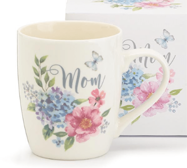 Cream ceramic mug with pastel flowers, butterflies, and the word Mom on the front
